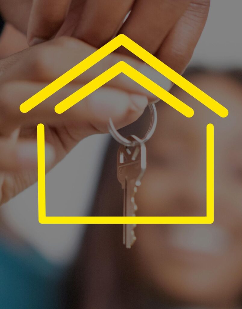 pexels-photo-7768228-7768228 Close-up of hands holding house keys with yellow house icon overlay, representing real estate.